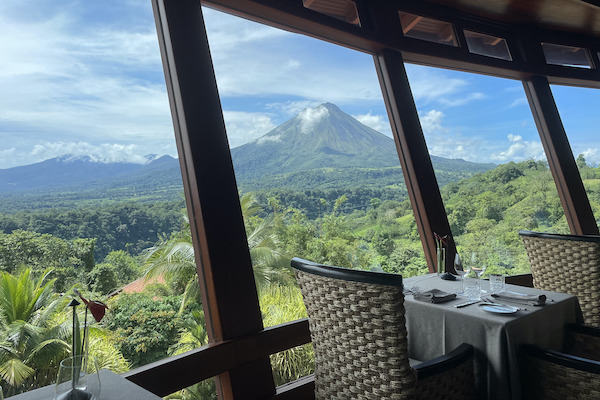 empty restaurant with panoramic view of La Fortuna volcano